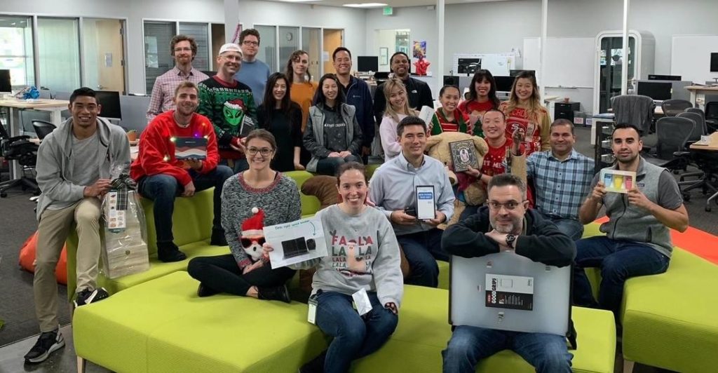 Our California SimpleLegal team poses with holiday gift swap goodies!
